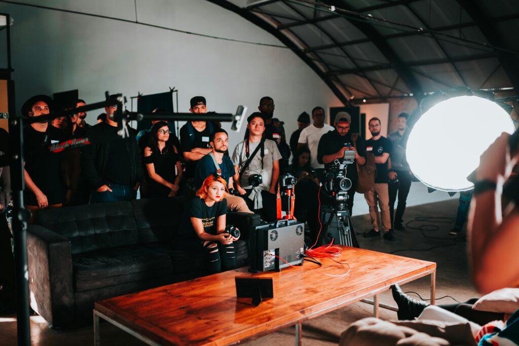pexels-photo-2608515-2608515 Photographers gathered in a studio for a collaborative photo shoot session.